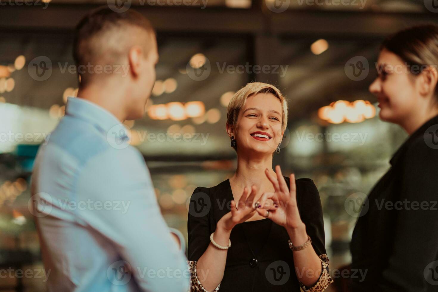 Photo of a business team of young people discussing business ideas in a modern urban environment. Selective focus