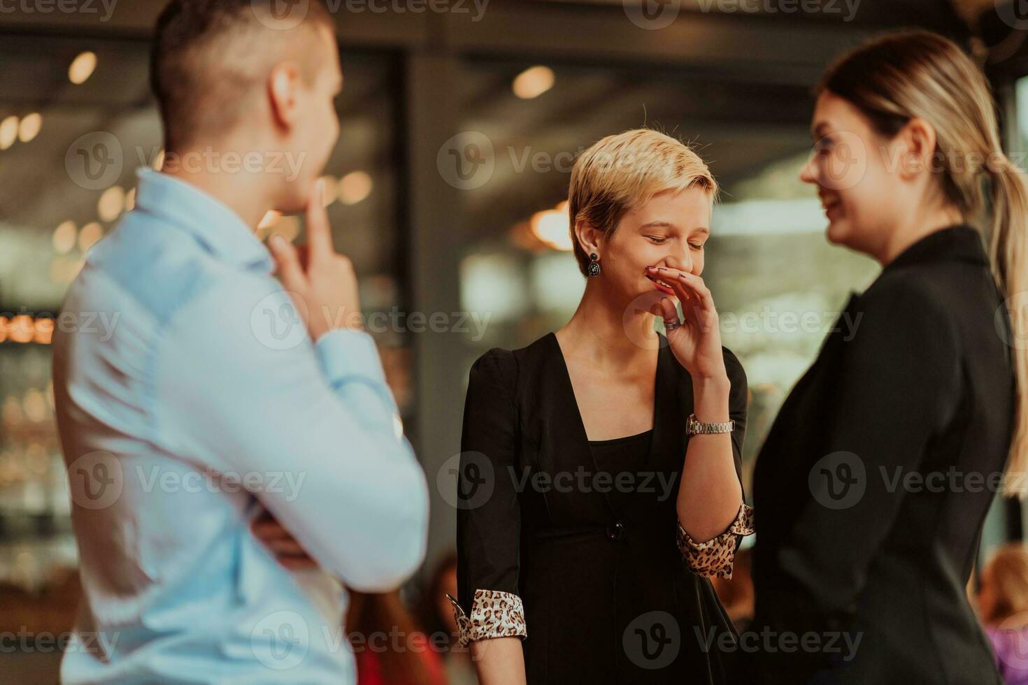Photo of a business team of young people discussing business ideas in a modern urban environment. Selective focus