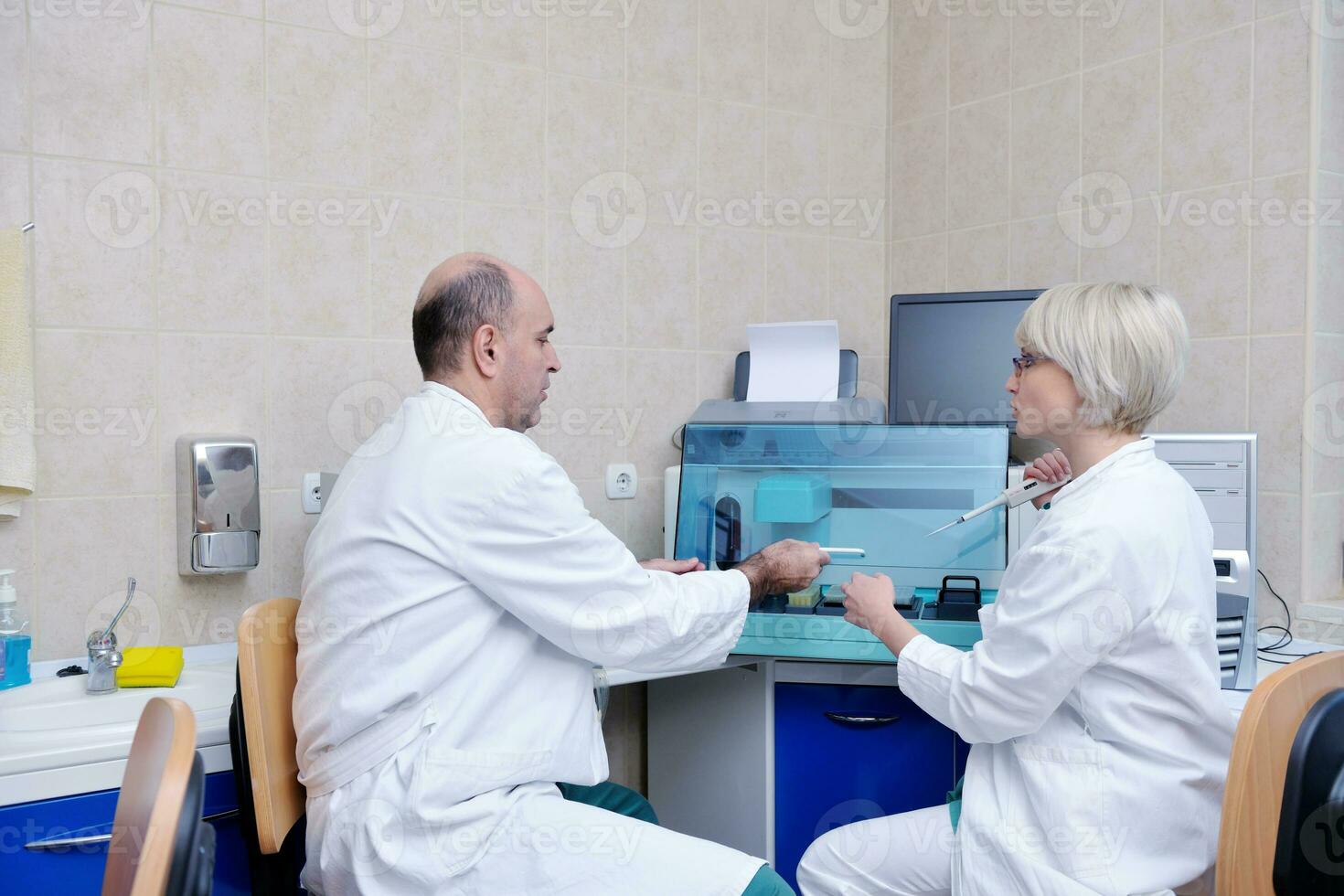 veterinarian and assistant in a small animal clinic photo