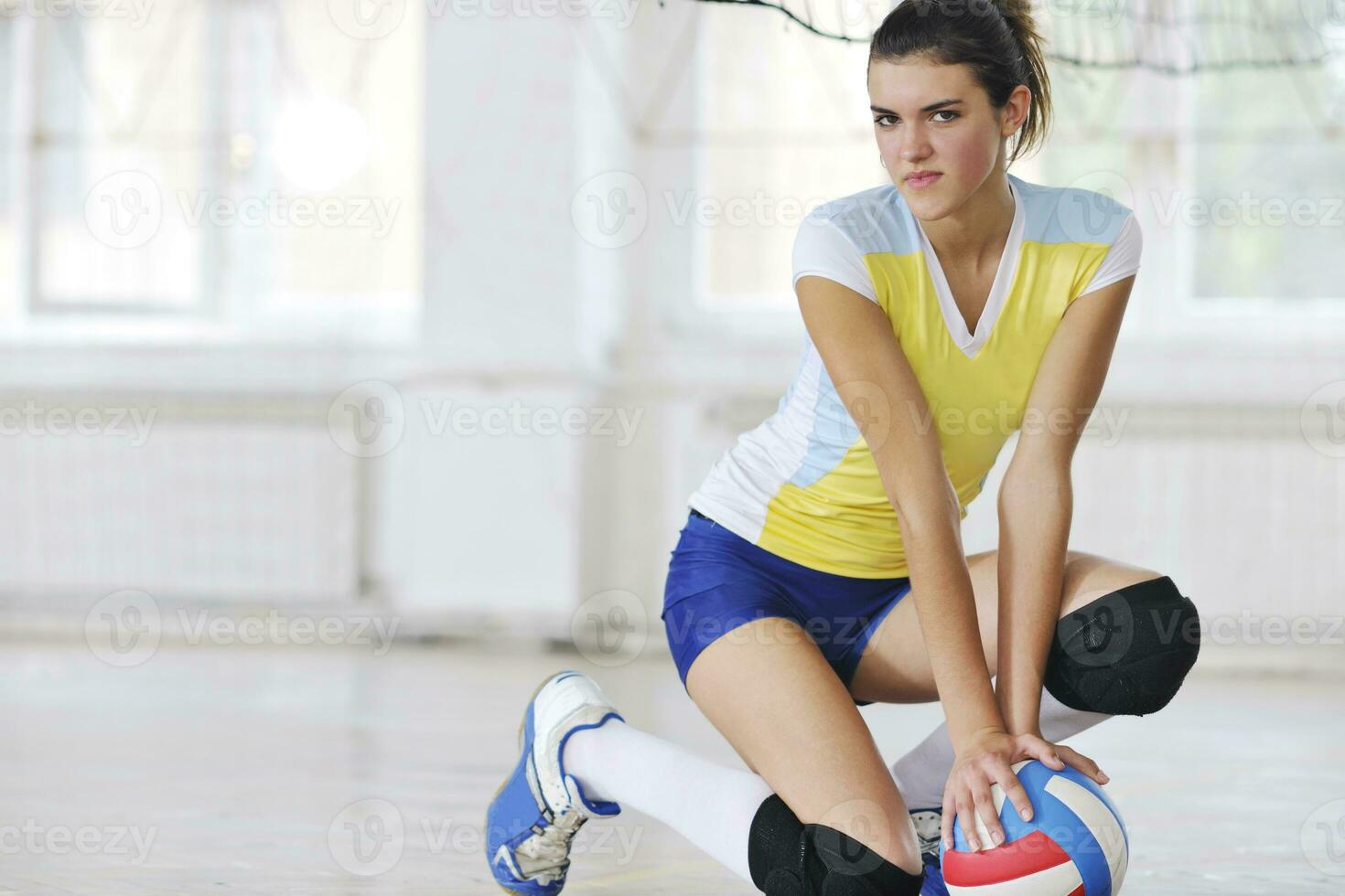 girls playing volleyball indoor game photo