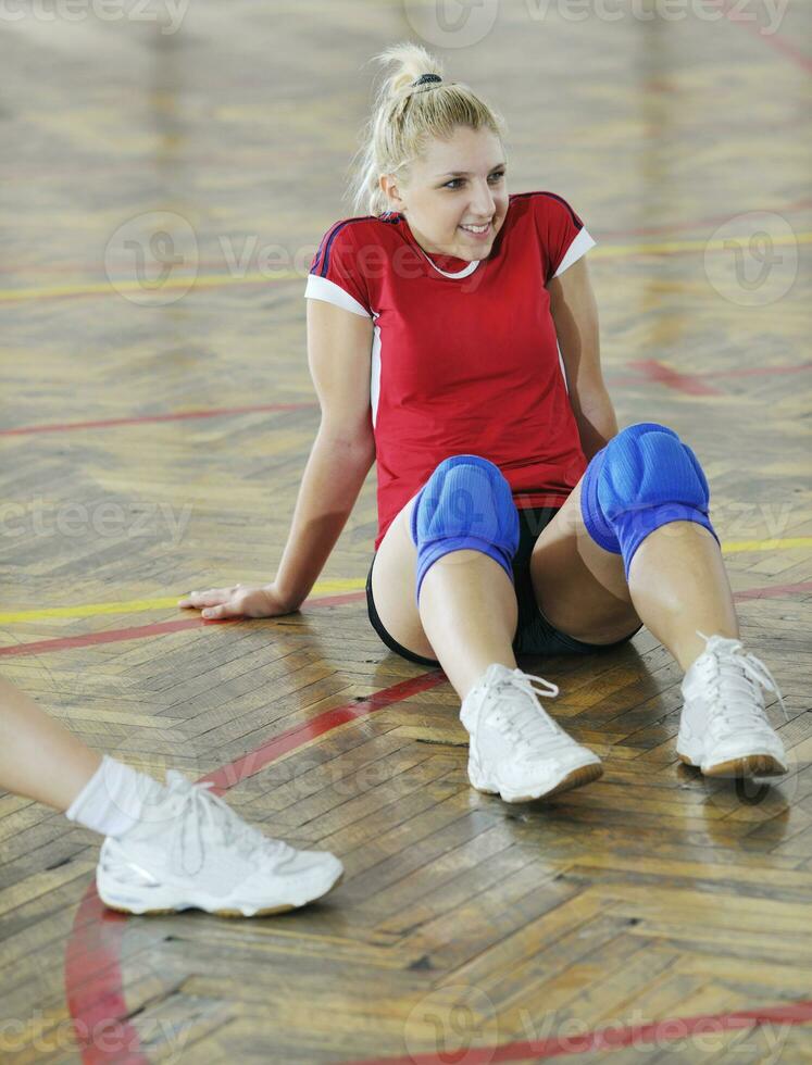 girls playing volleyball indoor game photo