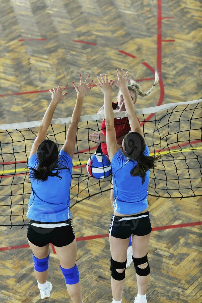 girls playing volleyball indoor game photo