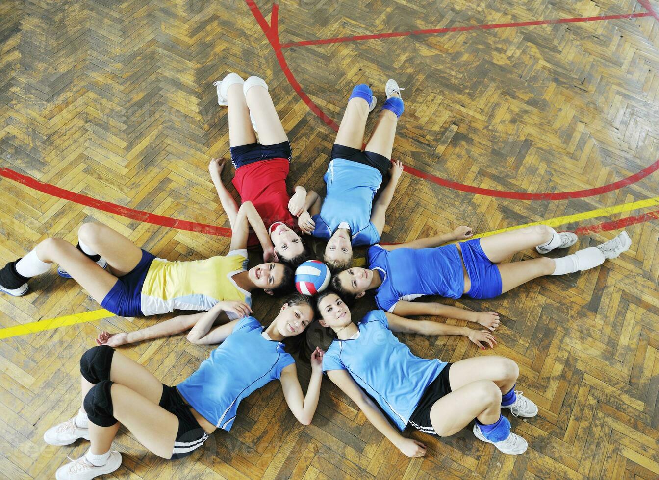 girls playing volleyball indoor game photo