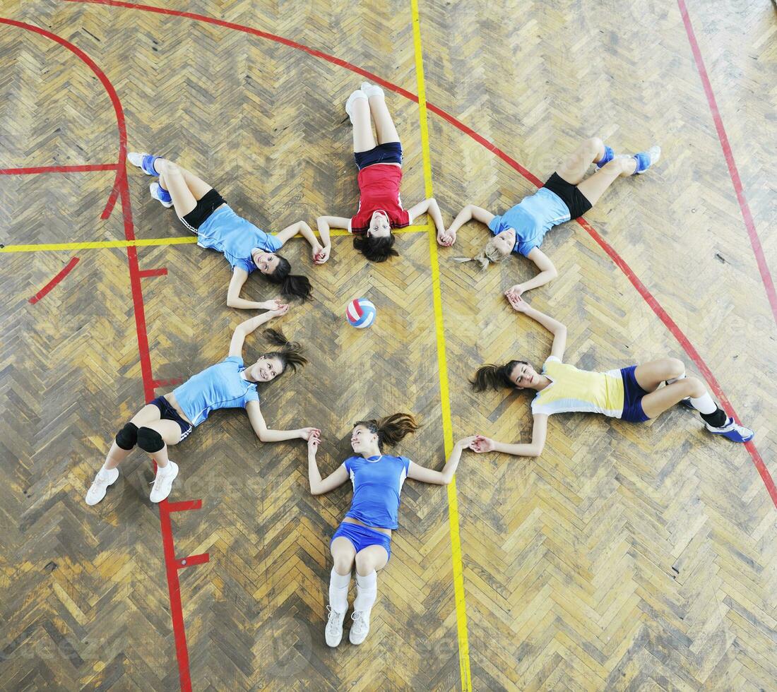 girls playing volleyball indoor game photo