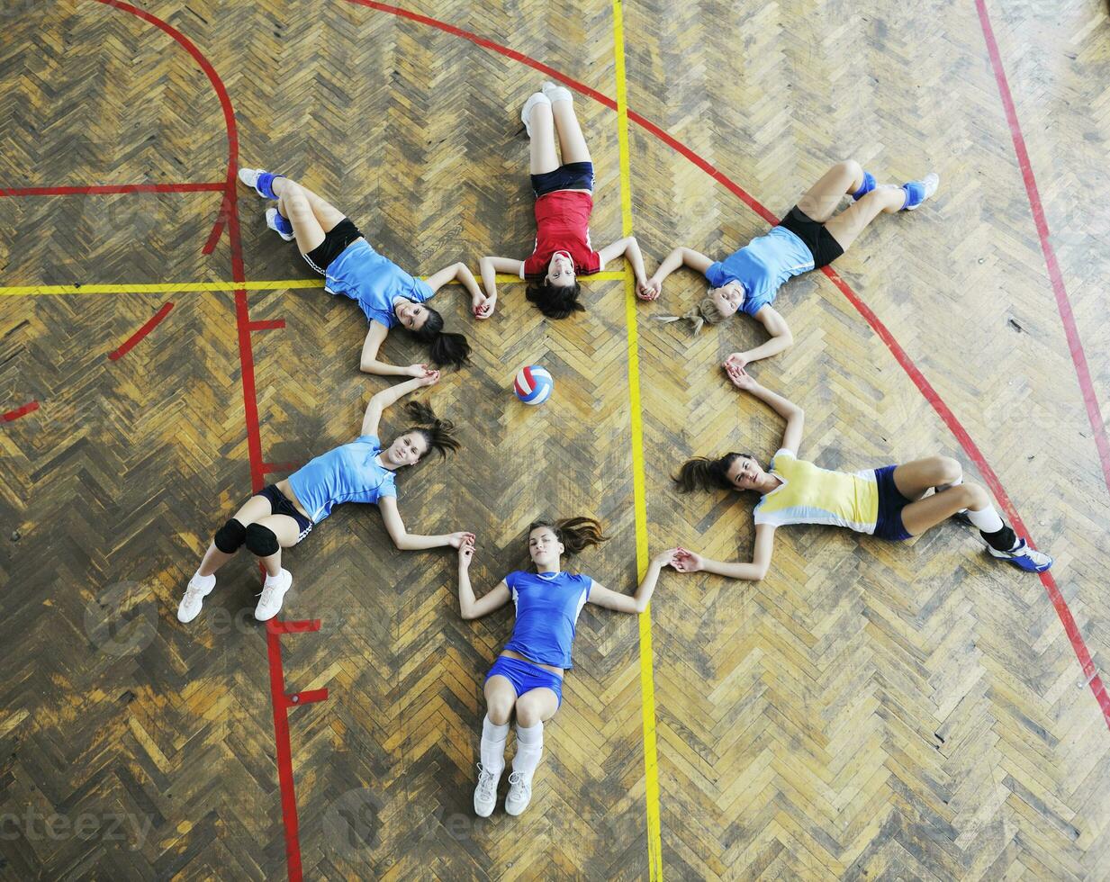 girls playing volleyball indoor game photo