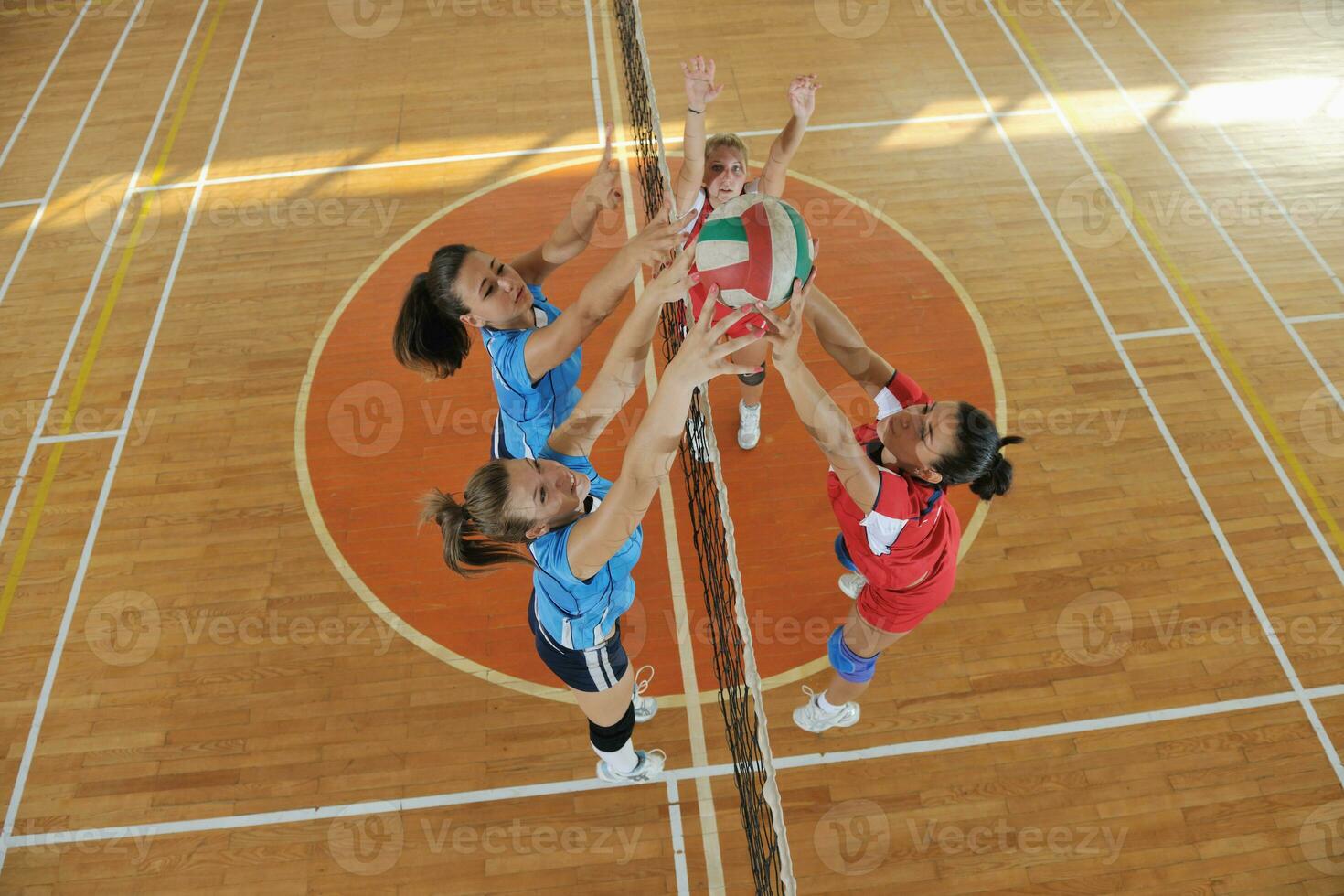 girls playing volleyball indoor game photo