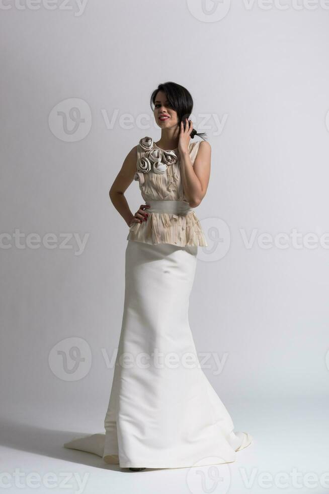 Portrait of beautiful young women in wedding dress photo