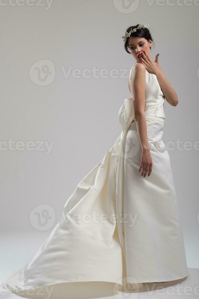 Portrait of beautiful young women in wedding dress photo