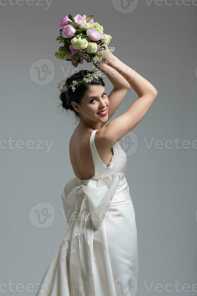 bride with a bouquet  isolated on white background photo