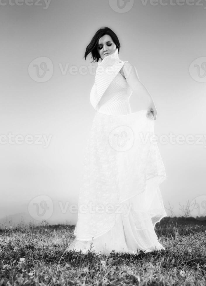 Beautiful bride outdoors in black and white photo