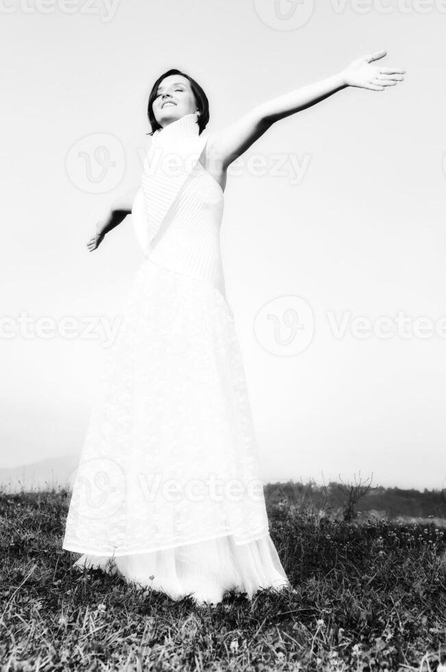 Beautiful bride outdoors in black and white photo