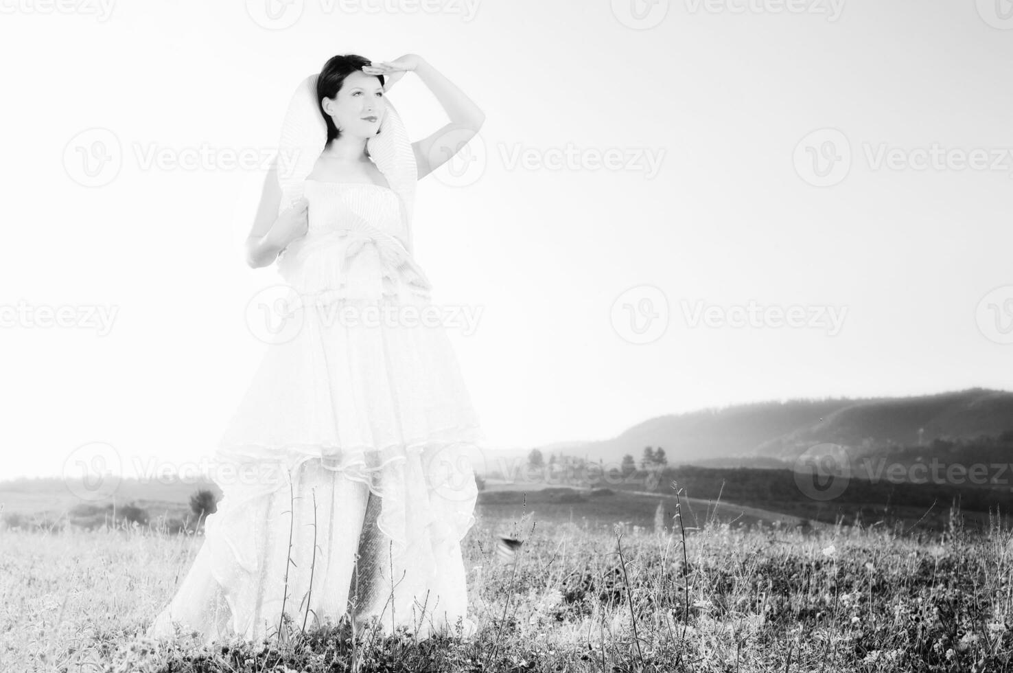 Beautiful bride outdoors in black and white photo