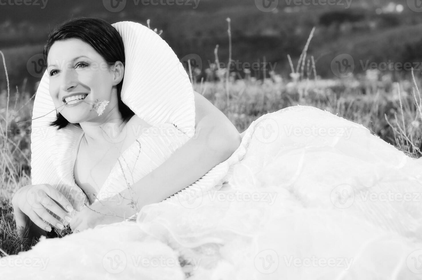 Beautiful bride outdoors in black and white photo