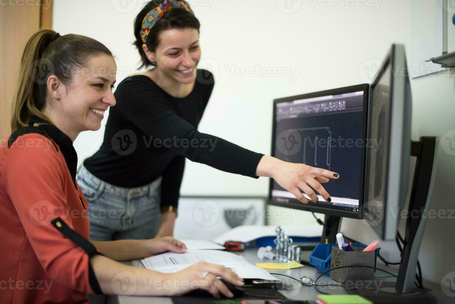 Within the heavy industry, a factory industrial engineer measures with a caliper and on a personal computer Designs a 3D model photo