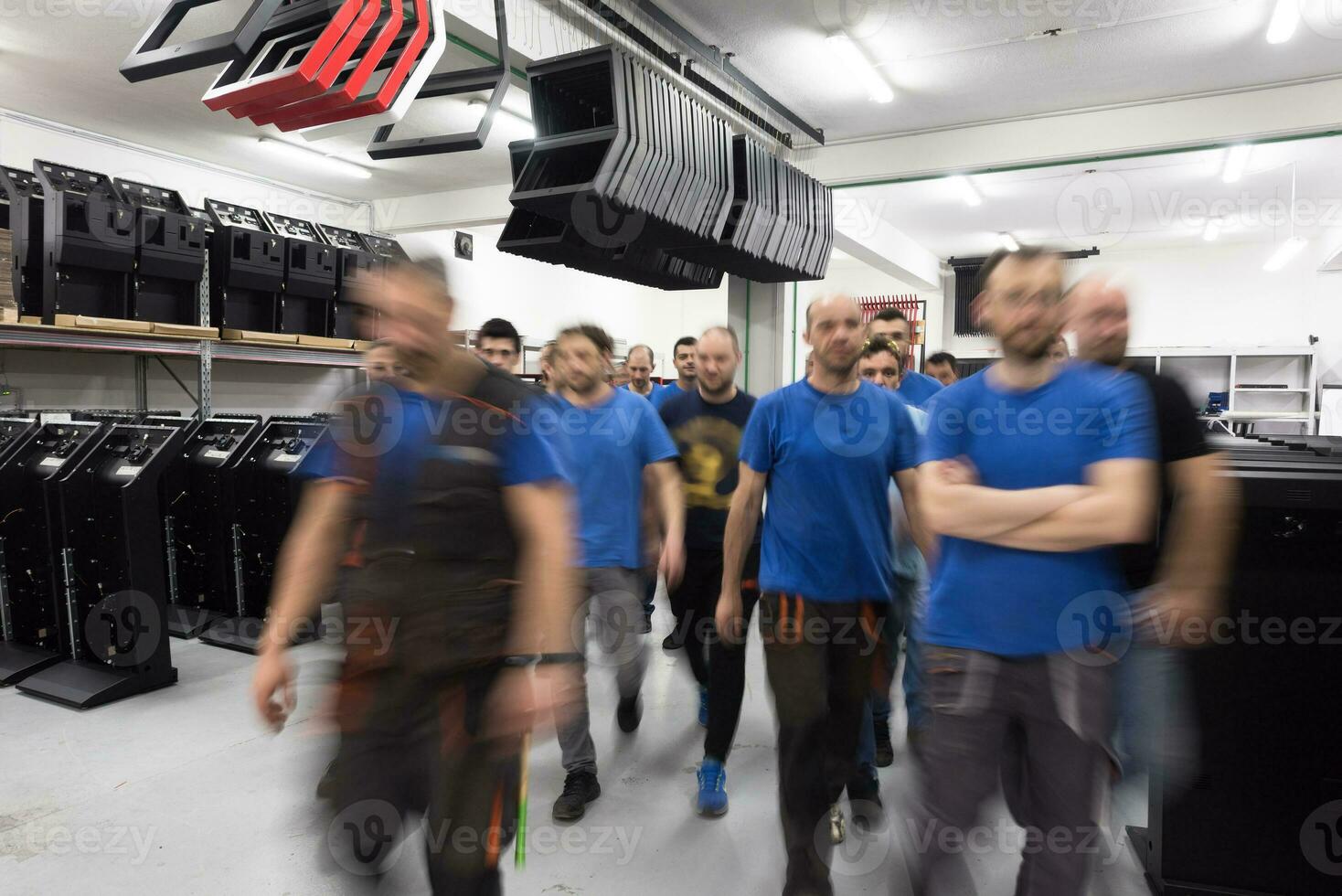 Blurred movement of workers in modern heavy industry while doing the jobs they are in charge of. Blurred photo. Selective focus photo