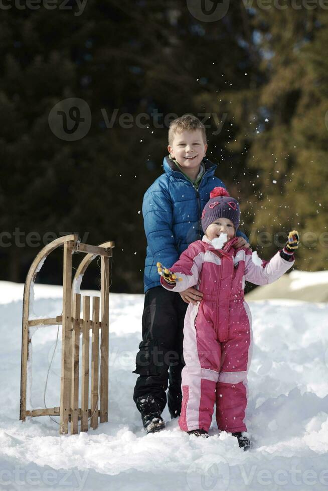 Brother and sister portrait in winter time photo