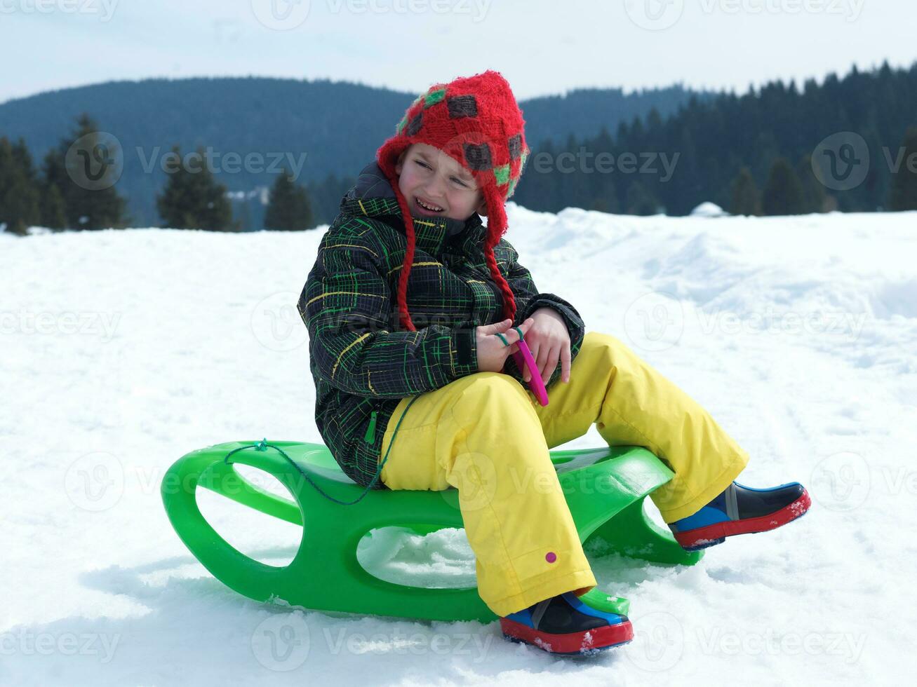 happy young boy have fun on winter vacatioin on fresh snow photo