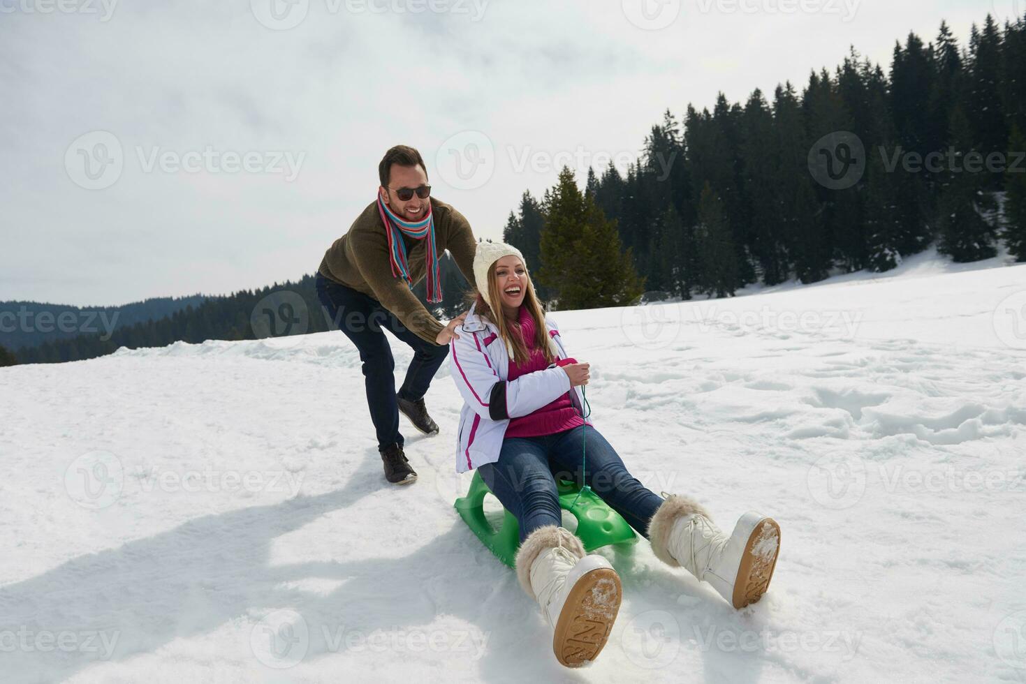 happy young couple having fun on fresh show on winter vacation photo