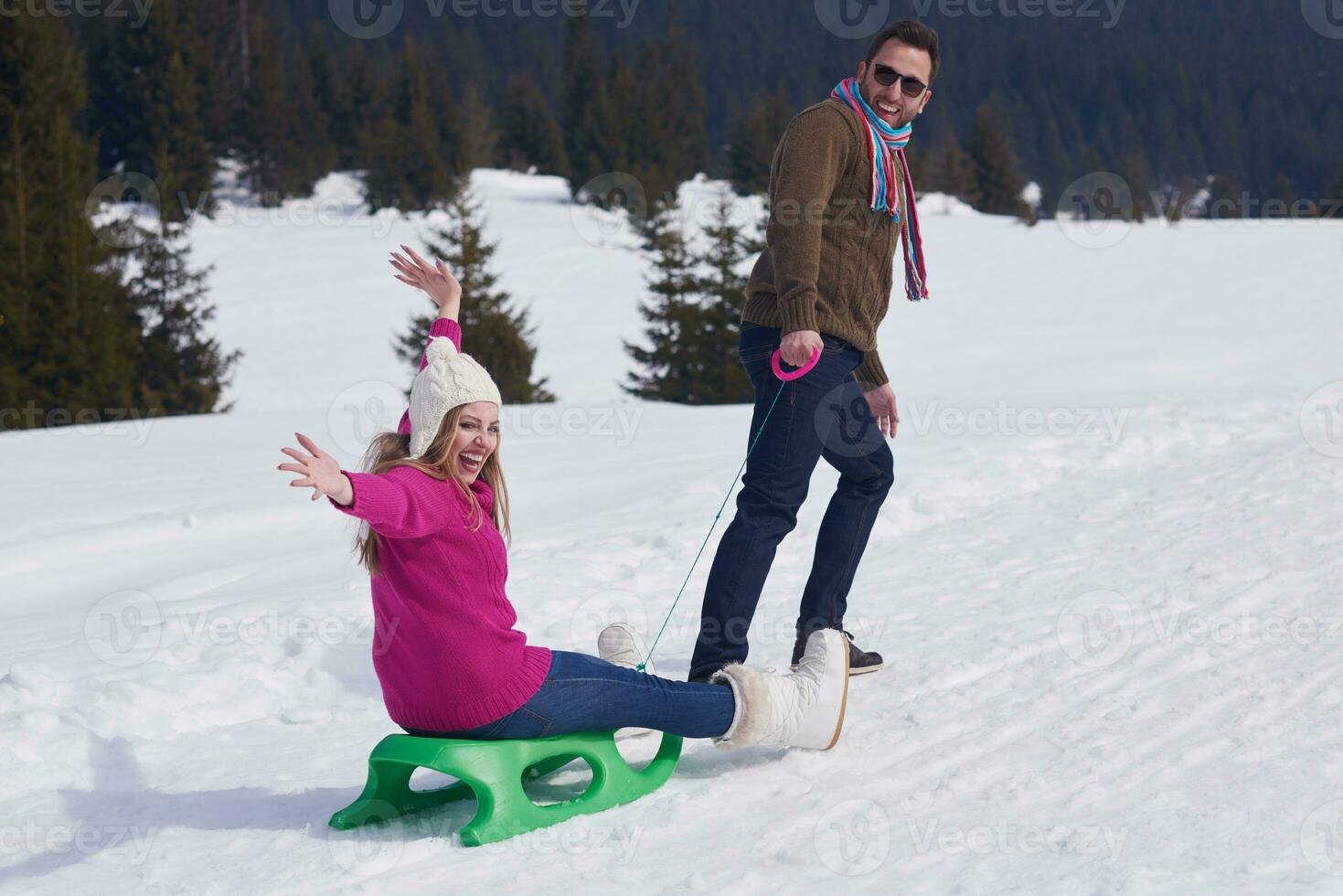 happy young couple having fun on fresh show on winter vacation photo