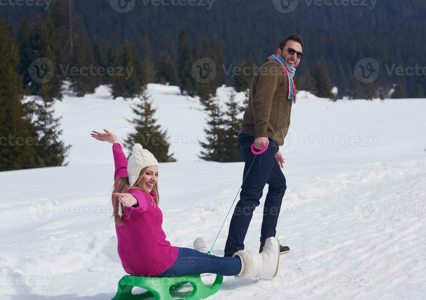 happy young couple having fun on fresh show on winter vacation photo