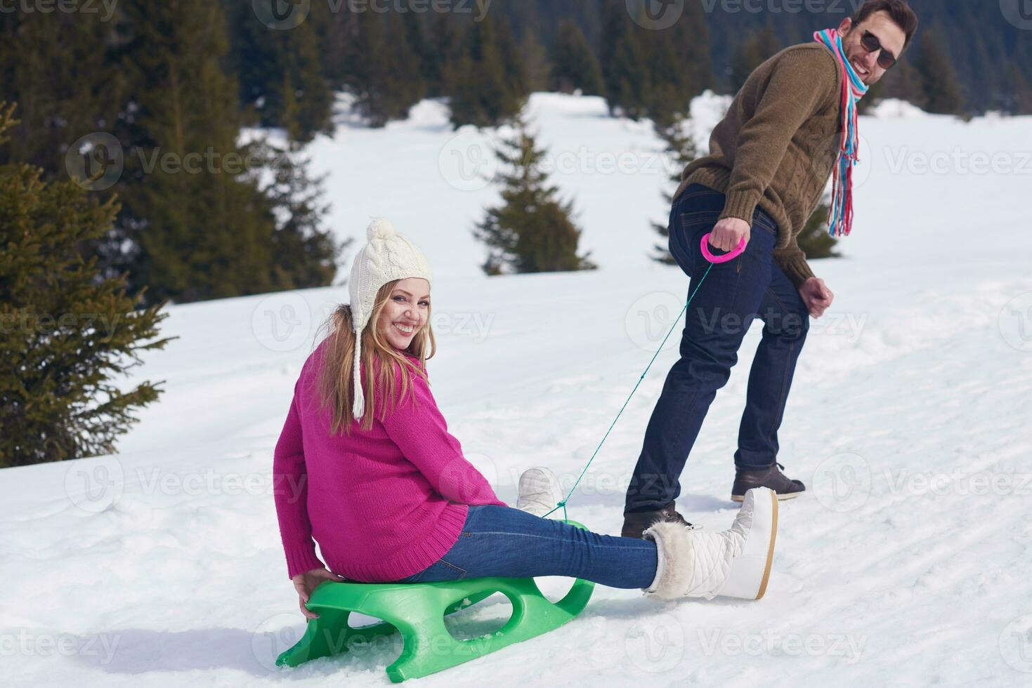 happy young couple having fun on fresh show on winter vacation photo