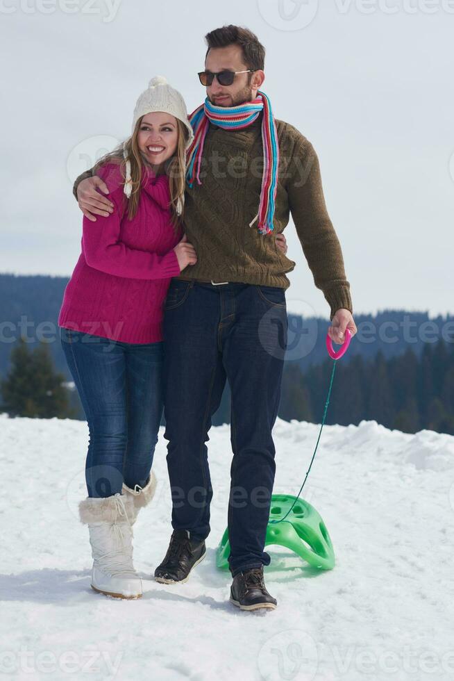 happy young couple having fun on fresh show on winter vacation photo