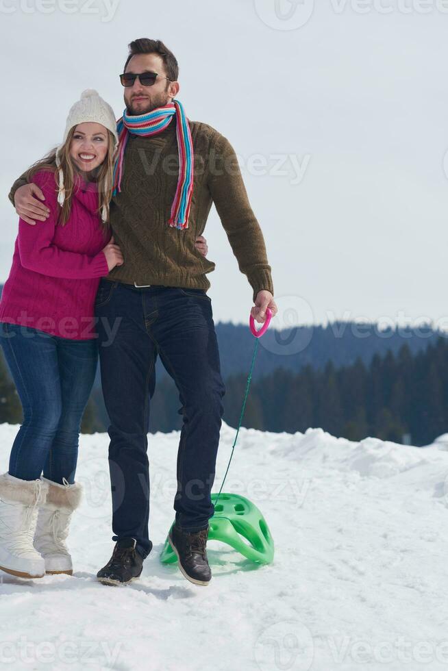 happy young couple having fun on fresh show on winter vacation photo