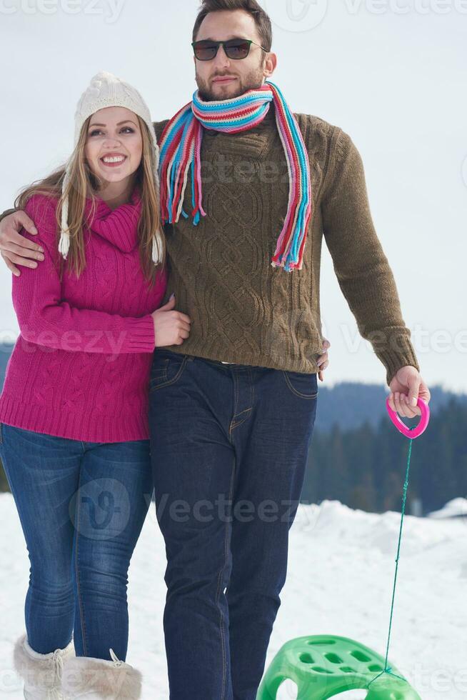 happy young couple having fun on fresh show on winter vacation photo