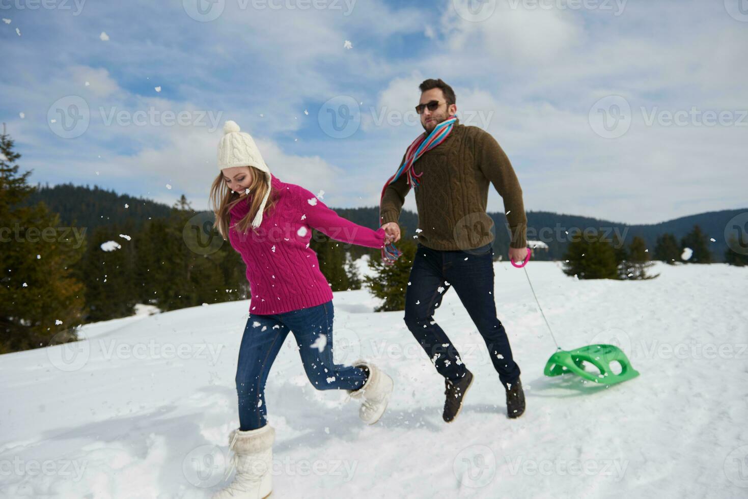 happy young couple having fun on fresh show on winter vacation photo