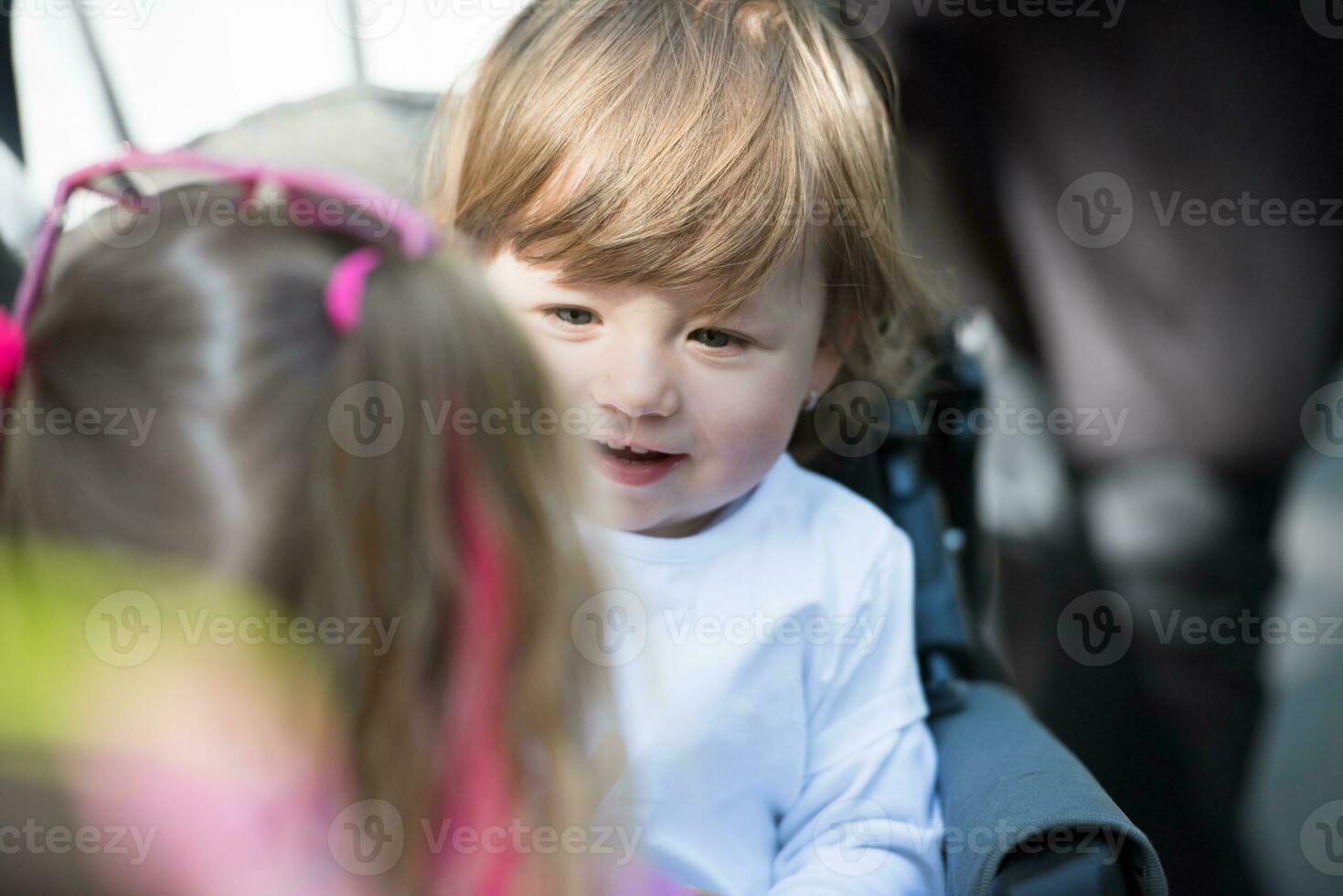 baby girl sitting in the pram photo