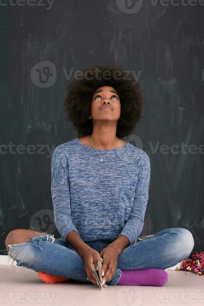 African American woman isolated on a gray background photo