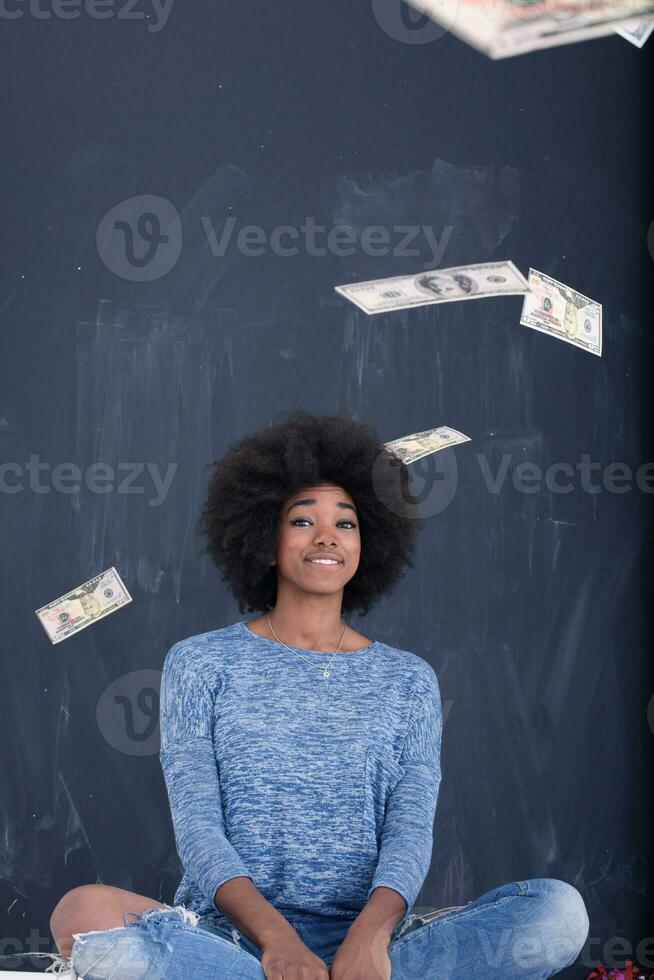 black woman throwing money photo