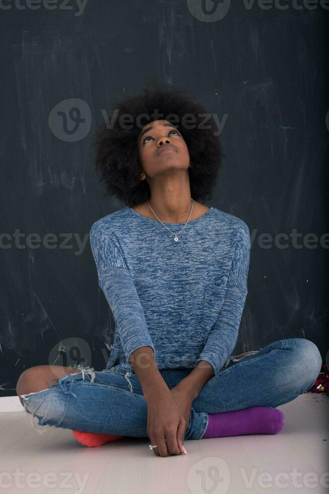 African American woman isolated on a gray background photo