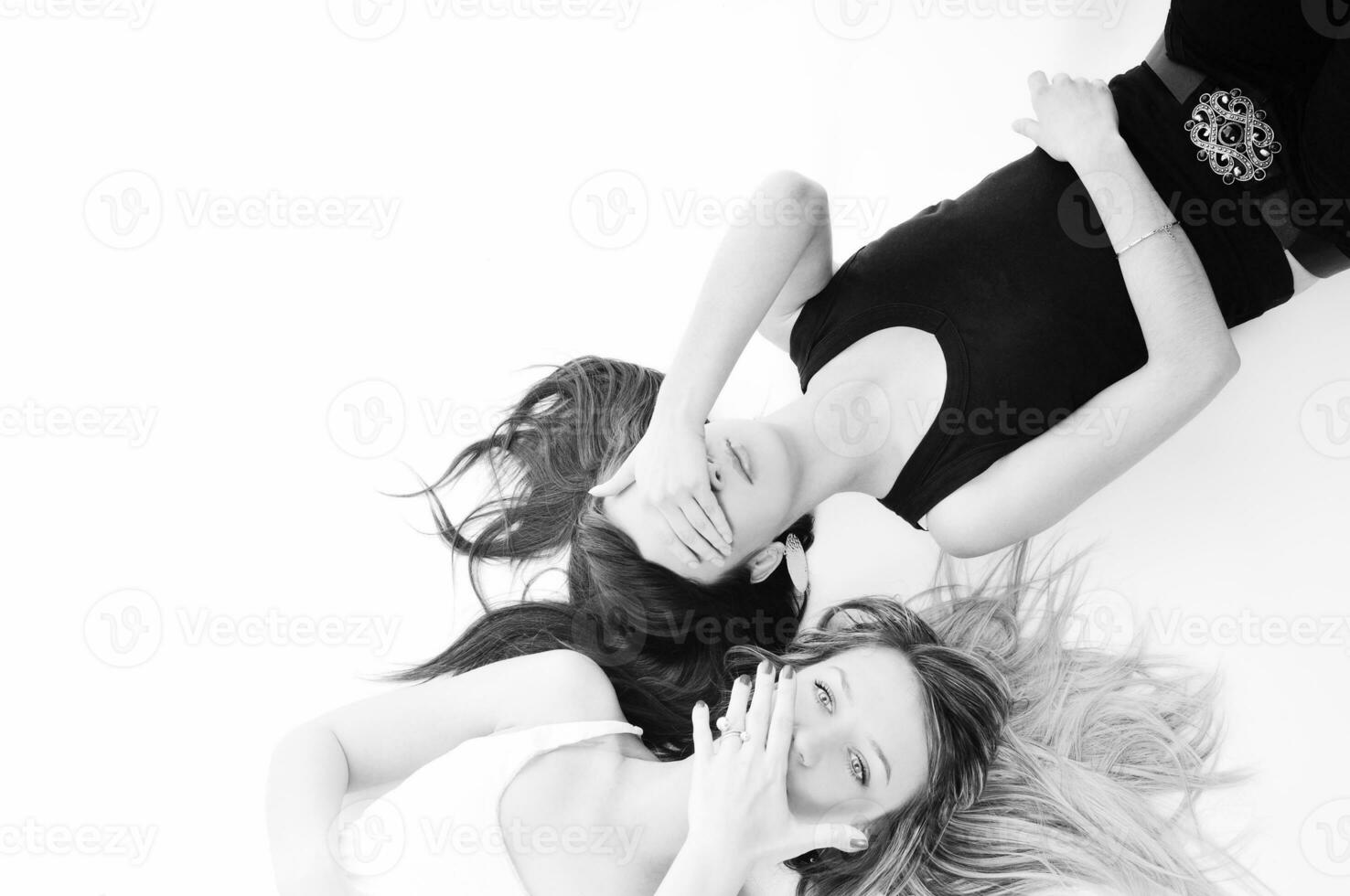 two woman lie on the floor photo
