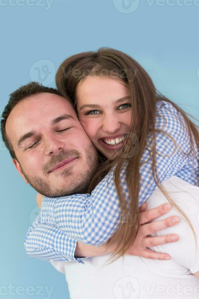 young man piggybacking his girlfriend photo