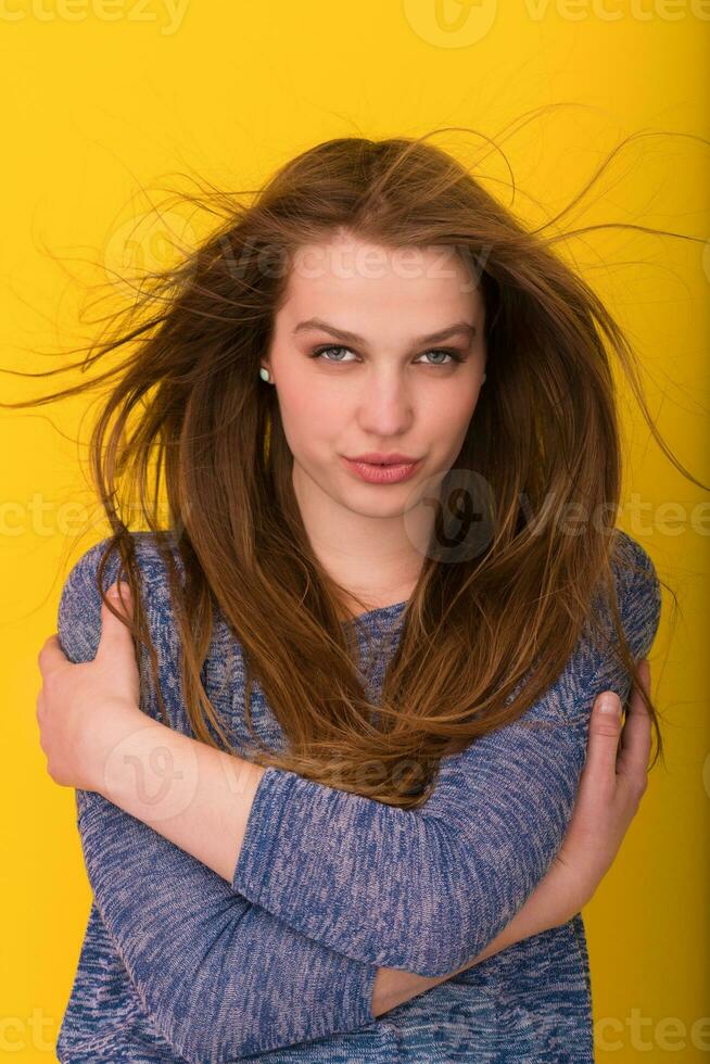 pretty woman playing with her long silky hair photo