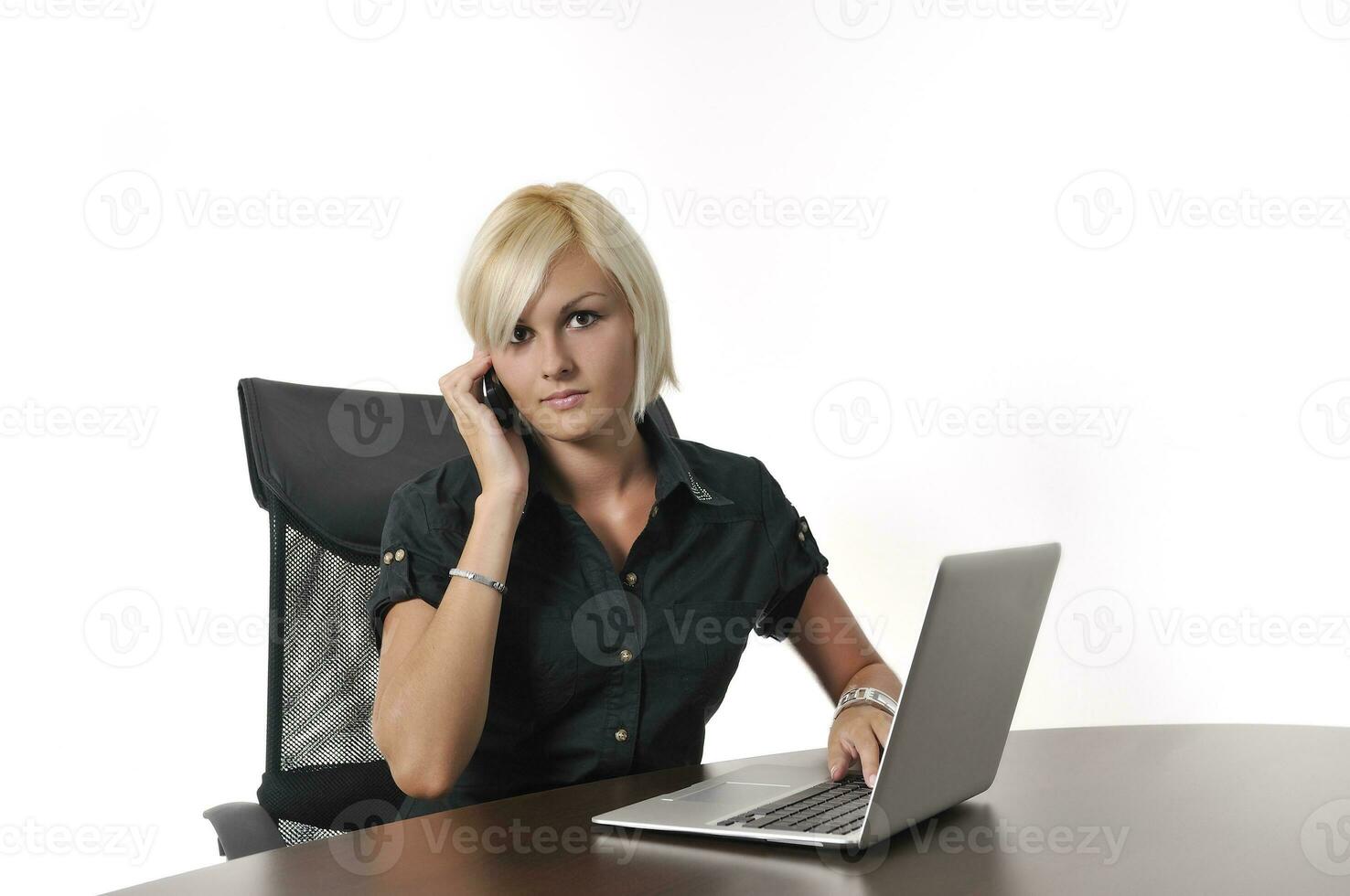 young business woman working in office on laptop photo