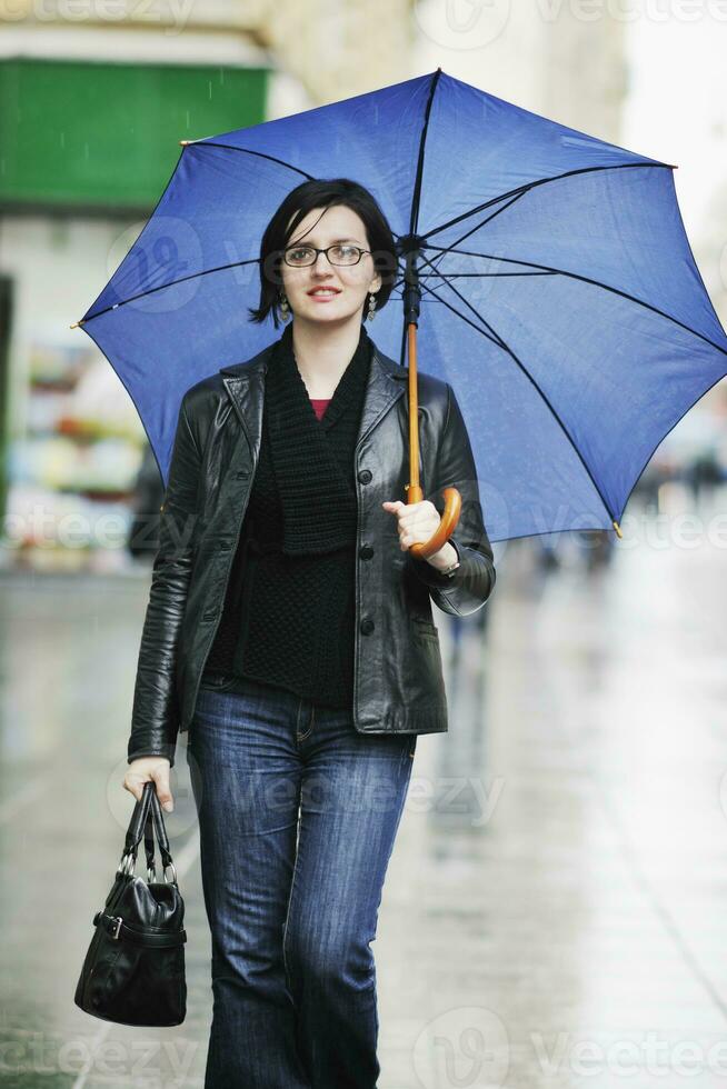 woman on street with umbrella photo