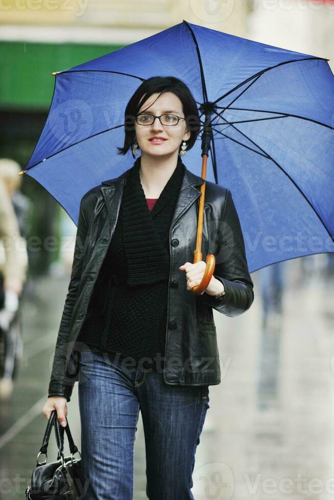 woman on street with umbrella photo