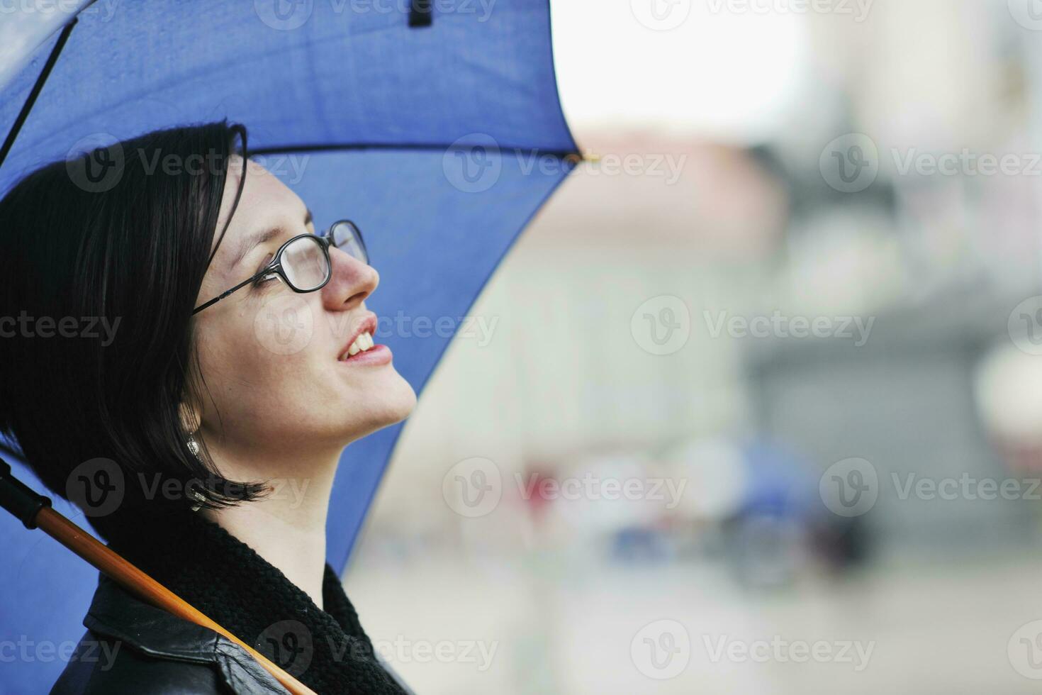 woman on street with umbrella photo