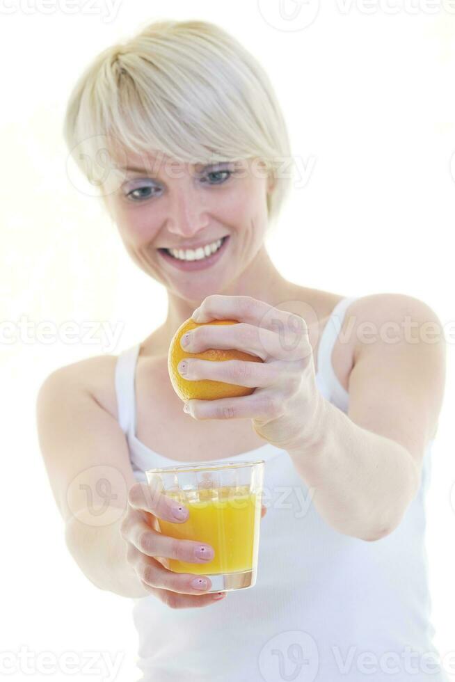 Young woman squeeze orange juice photo