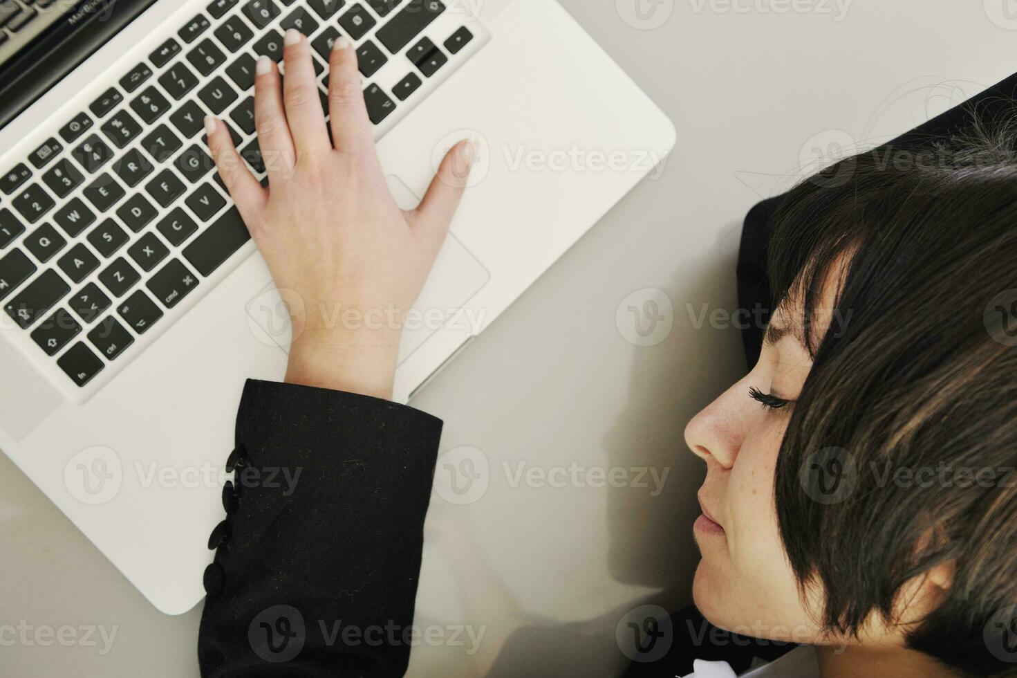business woman working on laptop photo