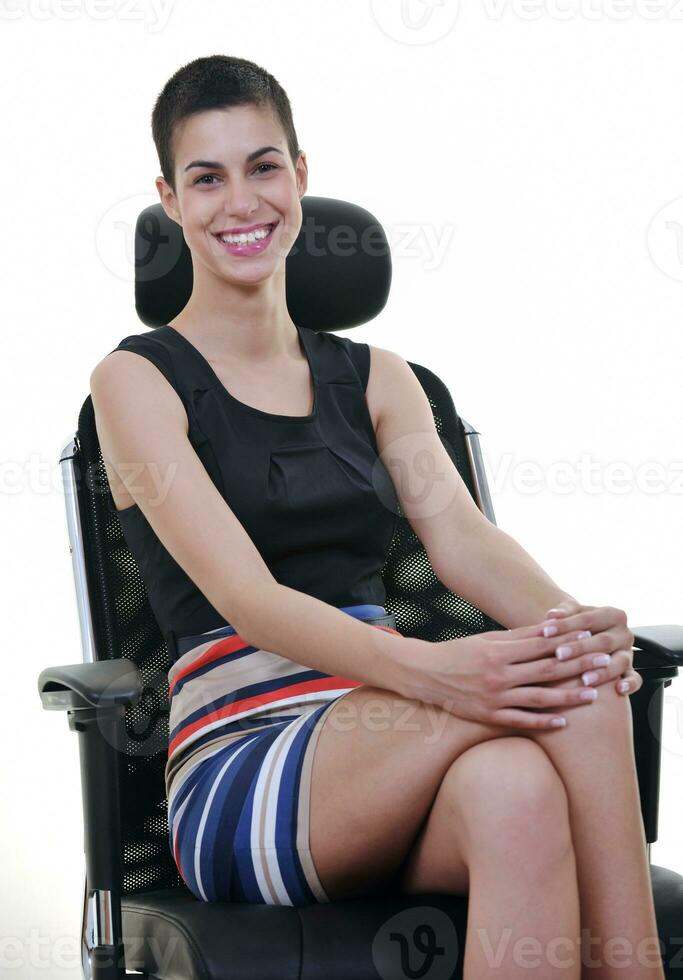 brunette female  model posing on business chair photo