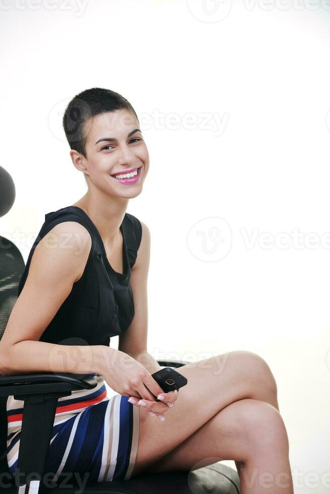 brunette female  model posing on business chair photo