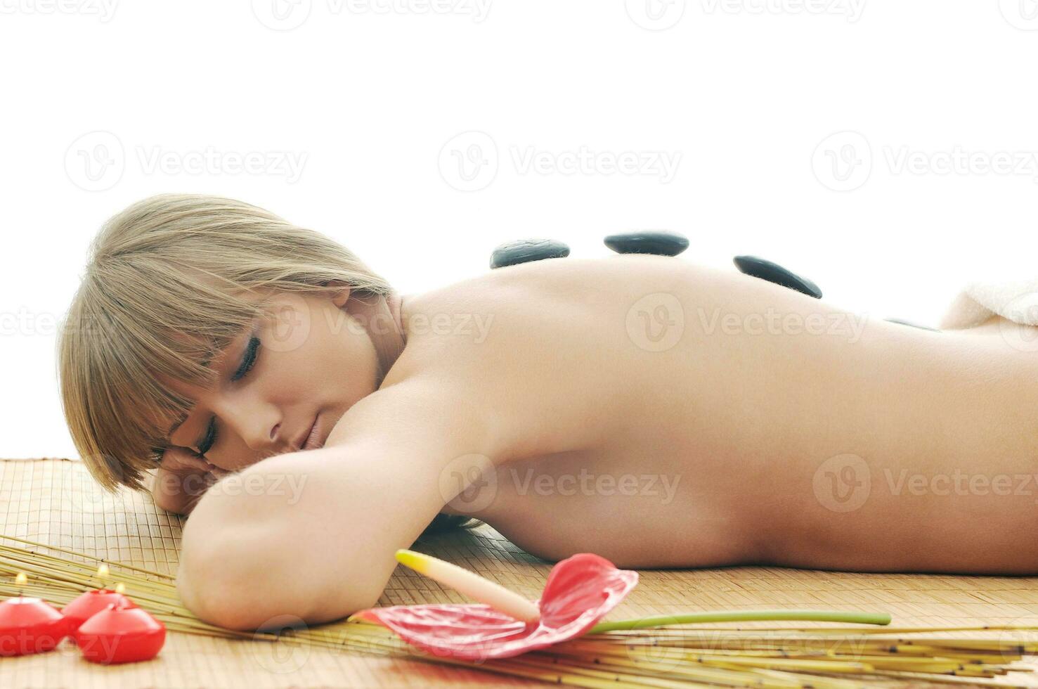 Massage with hot volcanic stones photo