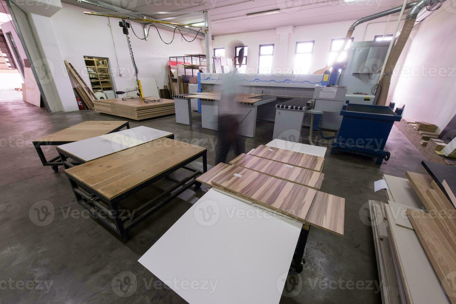 worker in a factory of wooden furniture photo