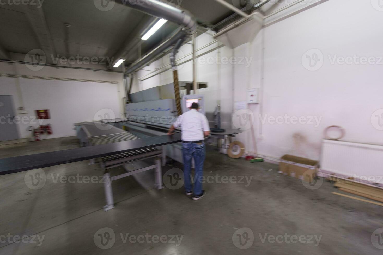 workers in a factory of wooden furniture photo