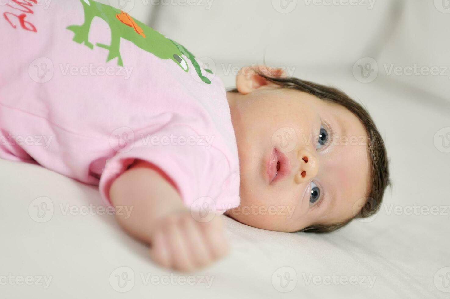 indoor portrait with happy young famil and  cute little babby photo