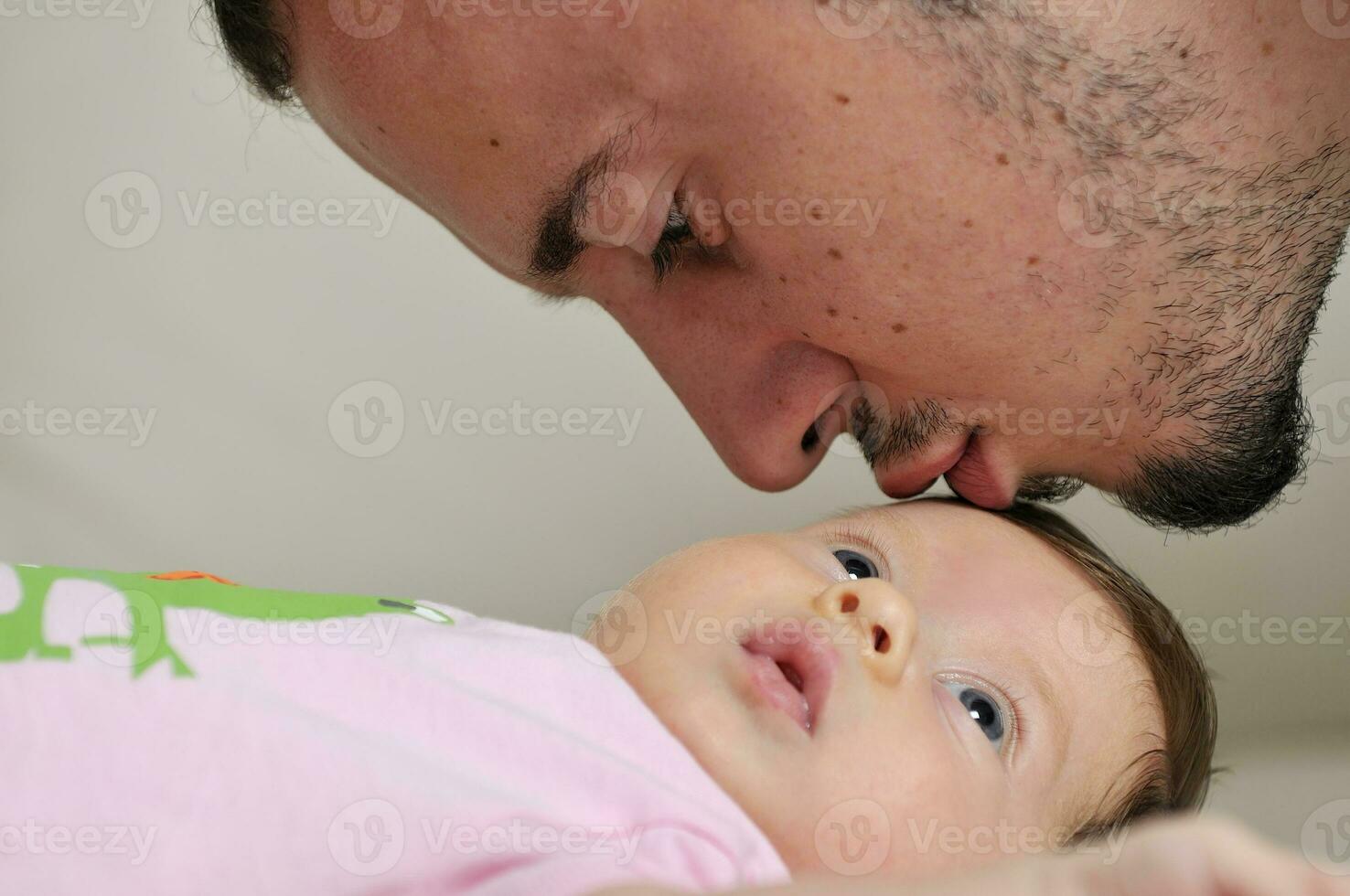 indoor portrait with happy young famil and  cute little babby photo