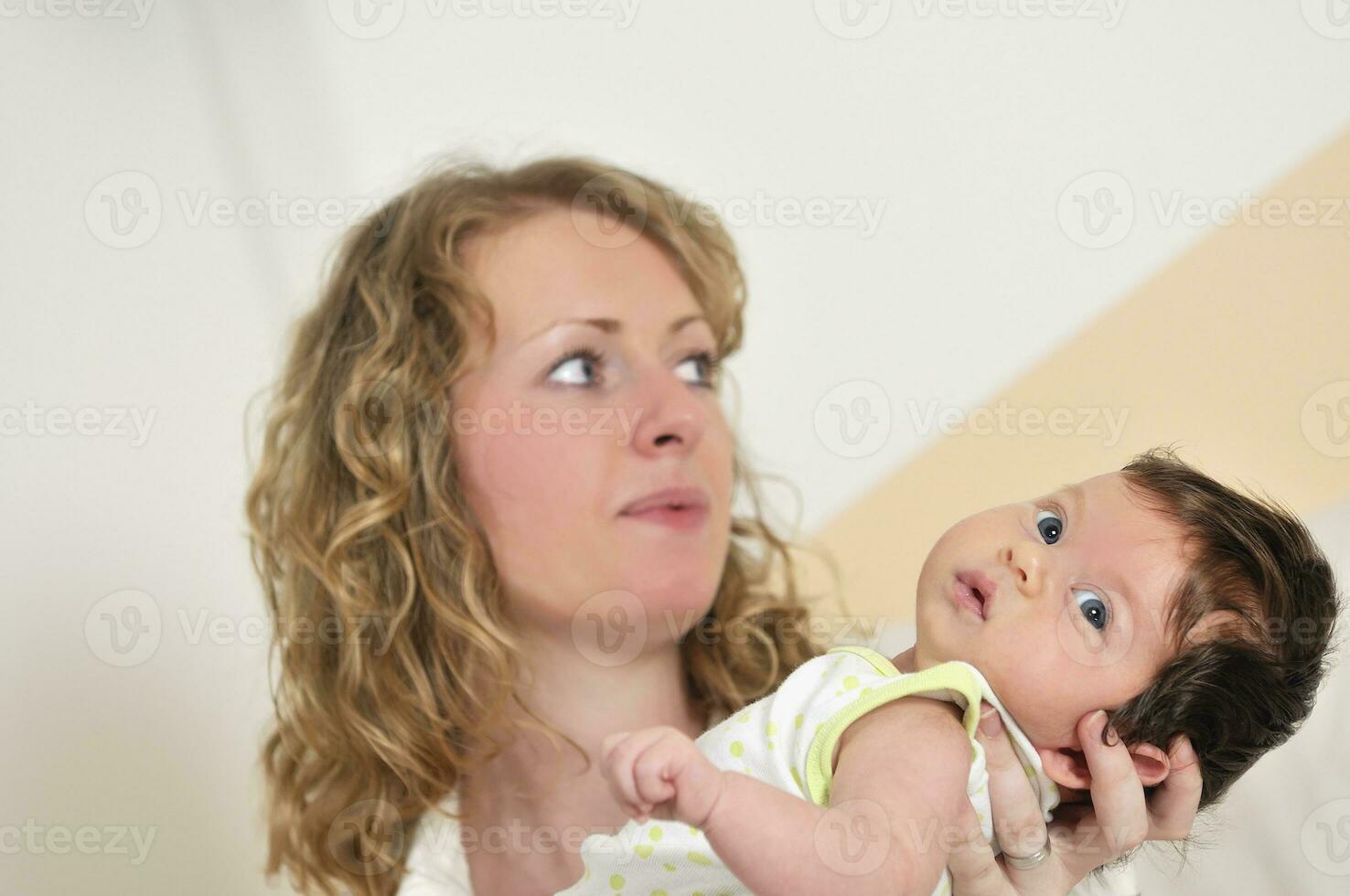 beautiful young mother small with little baby photo
